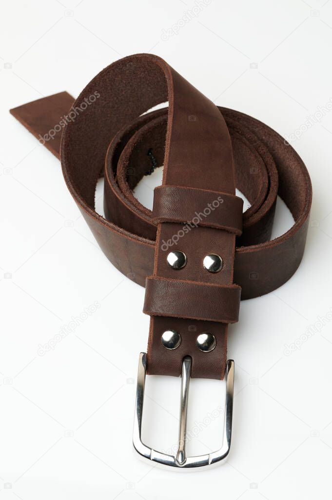Elegant brown color leather belt rolled isolated on white studio background