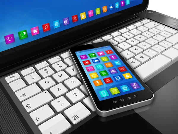 Smartphone sul computer portatile — Foto Stock