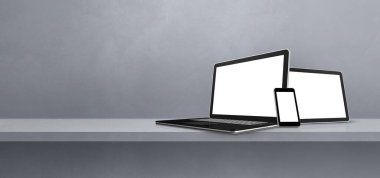 Gri duvar rafında dizüstü bilgisayar, cep telefonu ve dijital tablet bilgisayar var. Afiş arka planı. 3B Görüntü