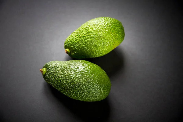 Two Fresh Avocados Isolated Black Background — Stock Photo, Image