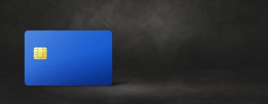 Siyah beton arka planda mavi kredi kartı şablonu. 3B illüstrasyon