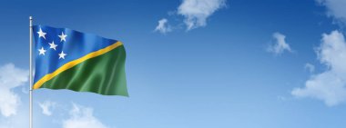 Solomon Adaları bayrağı, üç boyutlu, mavi gökyüzünde izole edilmiş. Yatay pankart. 3B illüstrasyon