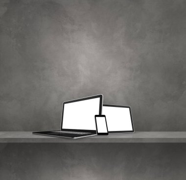 Gri duvar rafında dizüstü bilgisayar, cep telefonu ve dijital tablet bilgisayar var. Kare arka plan. 3B Görüntü