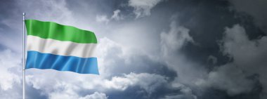 Sierra Leone flag on a cloudy sky, three dimensional render