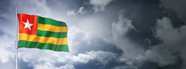 Togo flag on a cloudy sky, three dimensional render
