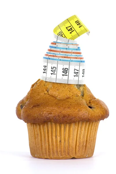 Cake with measuring tape — Stock Photo, Image