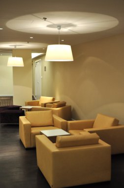 Modern interior with orange armchairs clipart