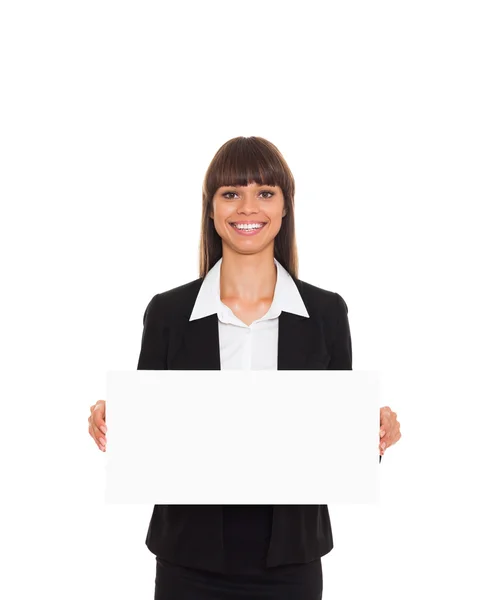 Business woman standing behind a blank board — Stock Photo, Image