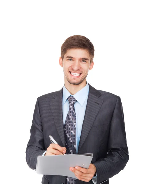 Guapo joven hombre de negocios feliz sonrisa escribiendo en portapapeles firmar contrato — Foto de Stock