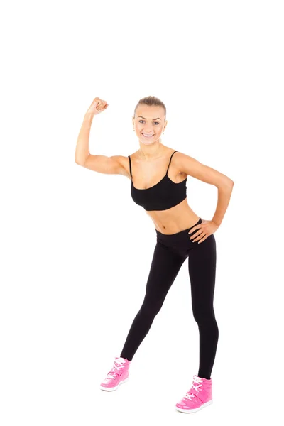 Sport fitness kvinna flexar Visa hennes biceps muskler — Stockfoto