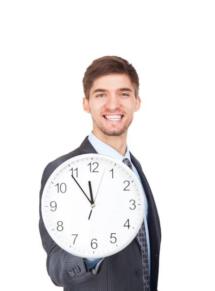 Бизнесмен держит часы — стоковое фото