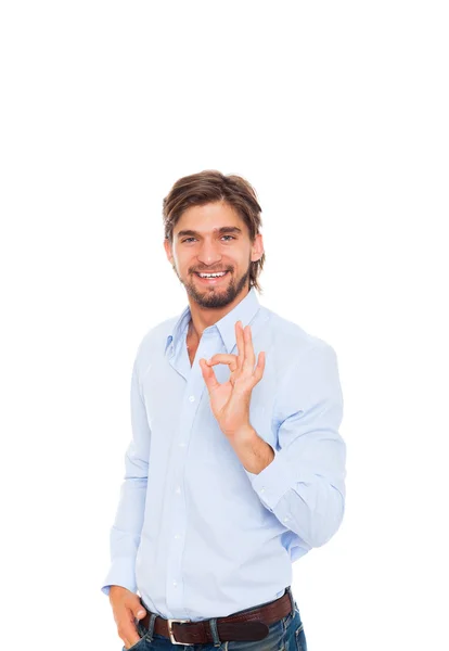 Yakışıklı genç iş adamı tutun el jest ok işareti ile — Stok fotoğraf