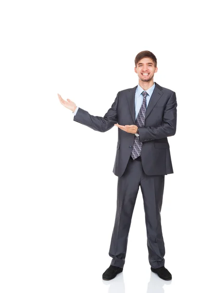 Handsome young business man hold open palm to empty copy space — Stock Photo, Image