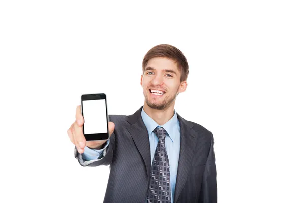 Hombre de negocios sosteniendo un teléfono móvil en blanco — Foto de Stock