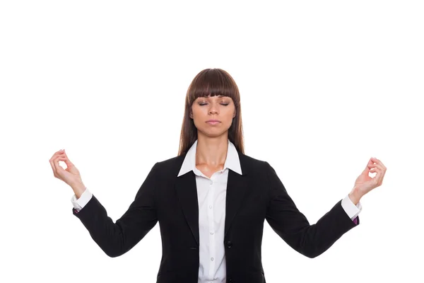 Mujer de negocios meditando y haciendo yoga —  Fotos de Stock