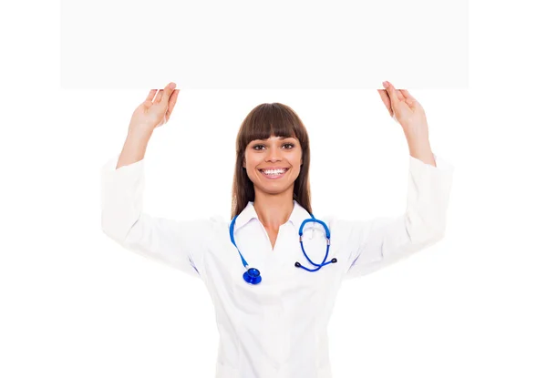 Doctor woman with stethoscope hold blank billboard — Stock Photo, Image