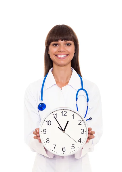 Medical doctor woman smile hold clock — Stock Photo, Image