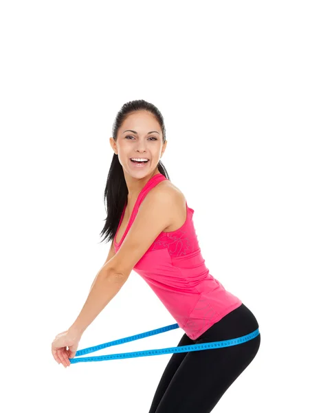 Sport fitness woman excited smile measure hips ass