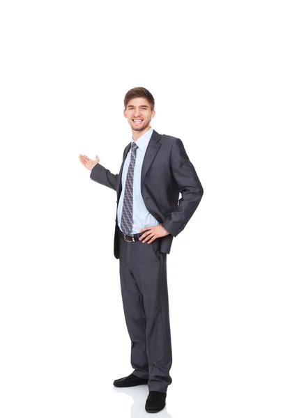 Handsome young business man hold open palm to empty copy space Royalty Free Stock Images