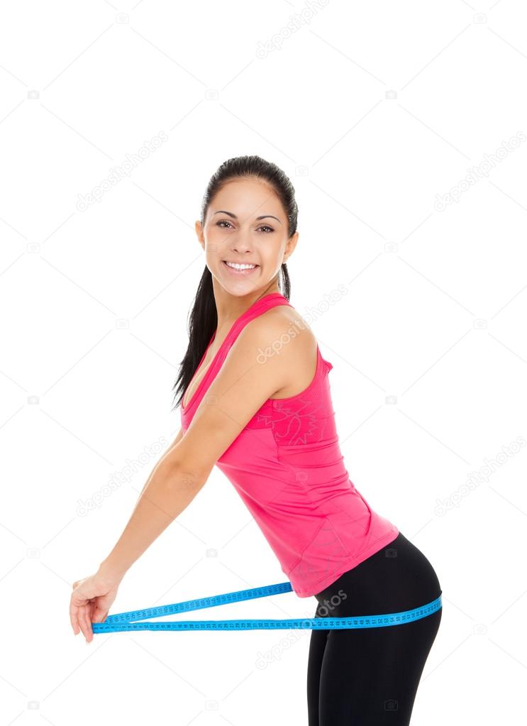 Sport fitness woman excited smile measure hips ass