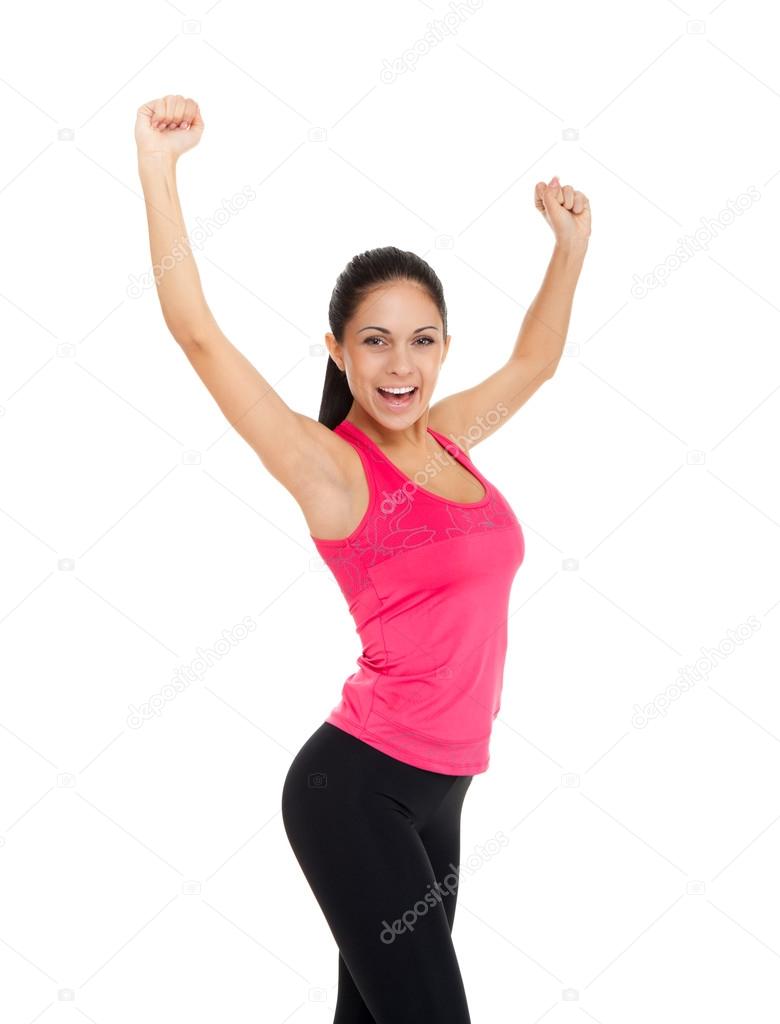 Sport fitness woman excited happy smile hold raised arm hand up