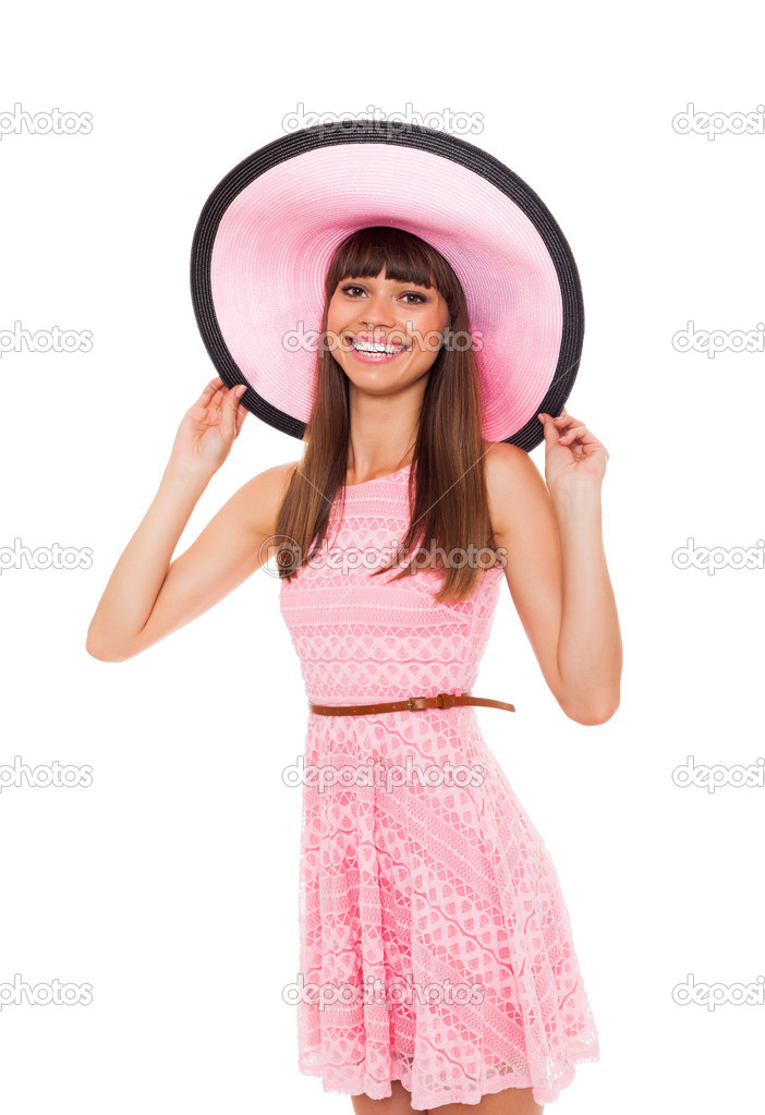 Woman in pink summer dress and hat