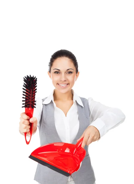 Businesswoman holding red scoop and broom — Stockfoto