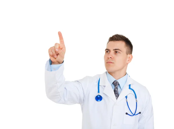 Médico com estetoscópio apontando o dedo até o canto — Fotografia de Stock