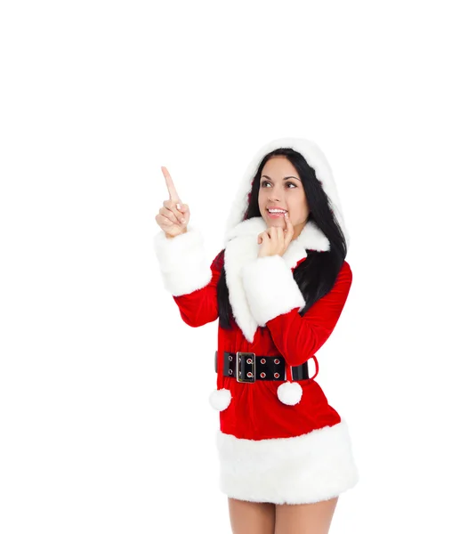 Woman wearing Santa Clause costume pointing to copy space — Stock Photo, Image