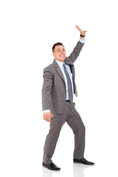 Guapo hombre de negocios sonrisa empujando espacio de copia — Foto de Stock