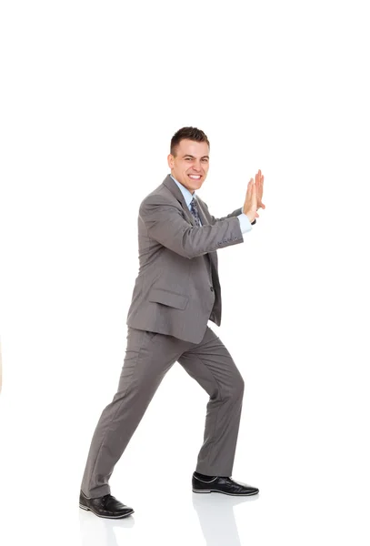 Guapo hombre de negocios sonrisa empujando espacio de copia —  Fotos de Stock