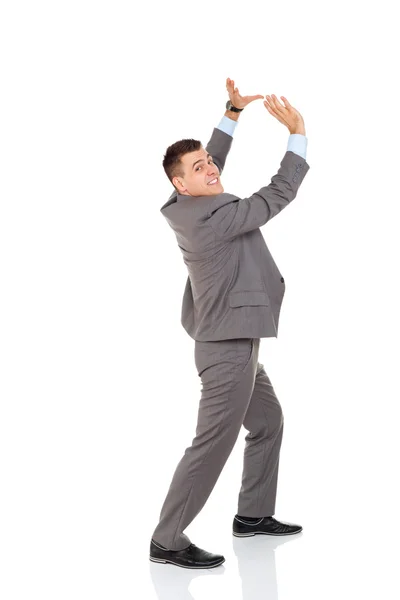 Guapo hombre de negocios sonrisa empujando espacio de copia — Foto de Stock