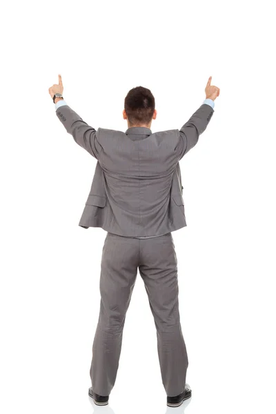 Rear view of business man pointing at copy space — Stock Photo, Image