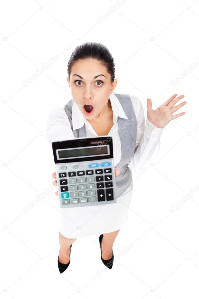 Shocked businesswoman and calculator