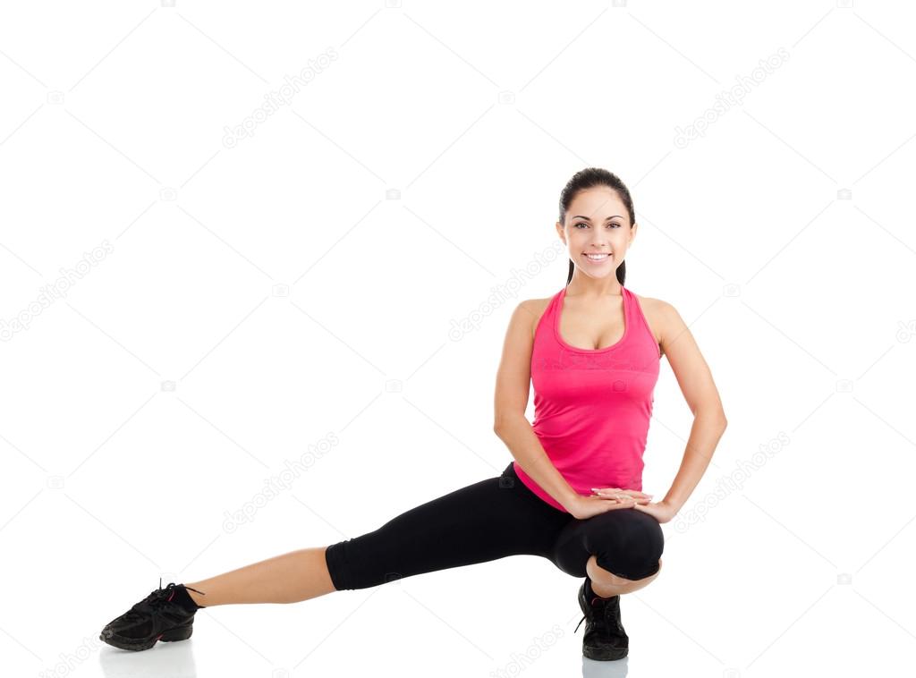 Young healthy girl doing stretching exercises