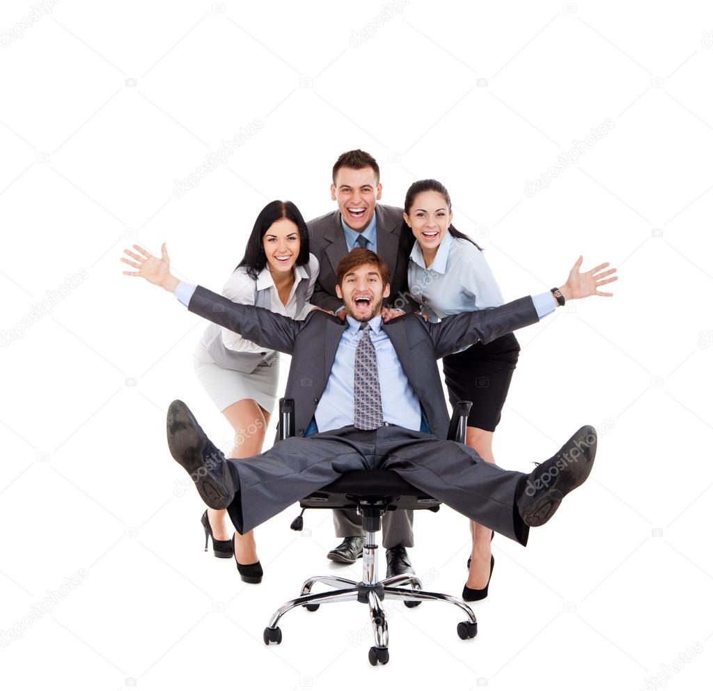 Excited Business people push colleague sitting in chair