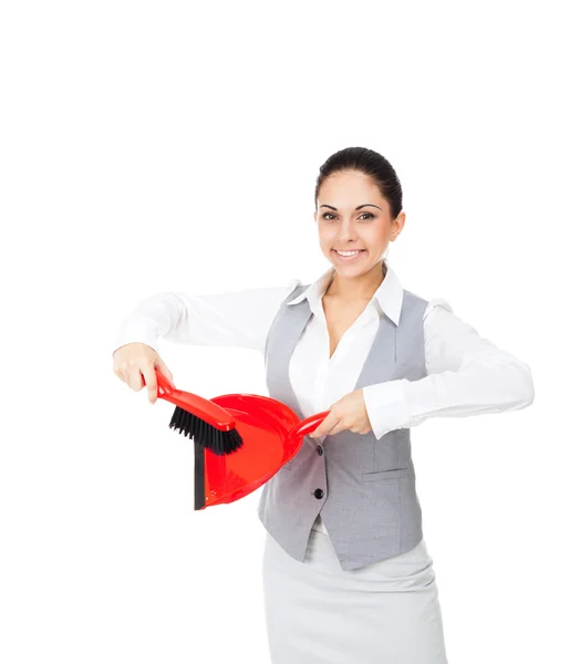 Businesswoman holding red scoop and broom — Stockfoto