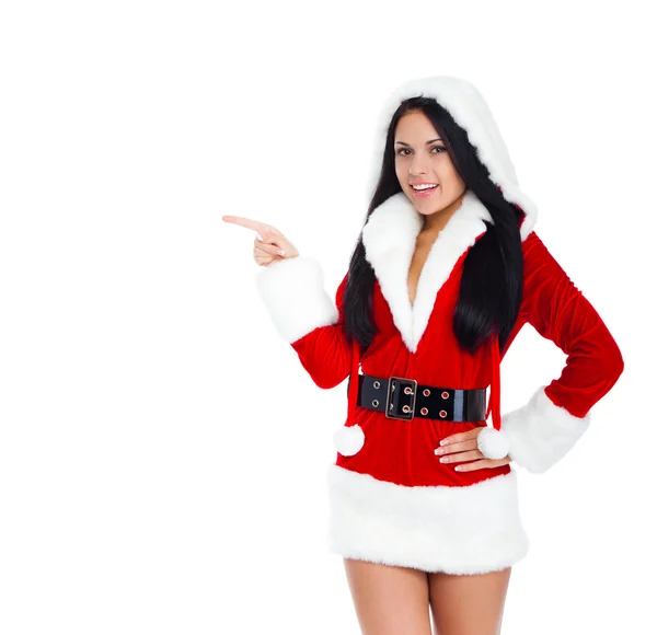 Frau im Weihnachtsmann-Kostüm deutet auf Kopierraum — Stockfoto