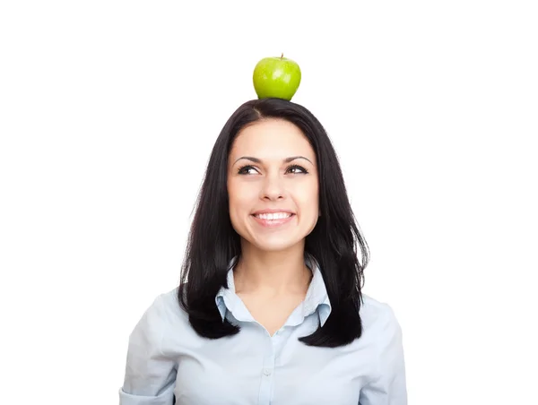 Young woman hold green fresh apple on head — Stock Photo, Image