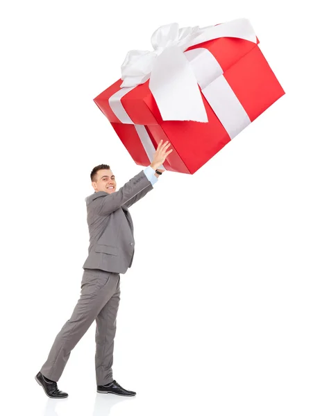 Businessman push big gift box — Stock Photo, Image