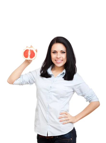 Mujer con pomelo cortado por la mitad — Foto de Stock