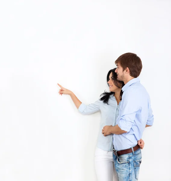Couple look side point finger to empty copy space — Stock Photo, Image