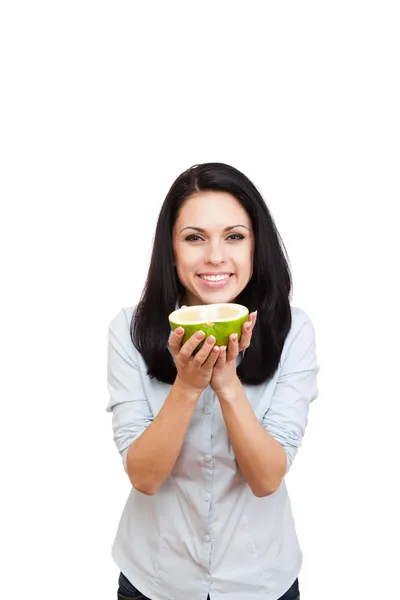 Young woman holding raw sweetie cut in half — Stock Photo, Image