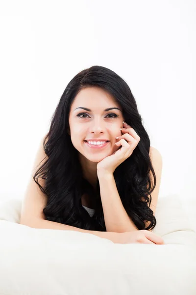 Beautiful young woman lying relaxing on the couch, sofa home indoors — Stock Photo, Image