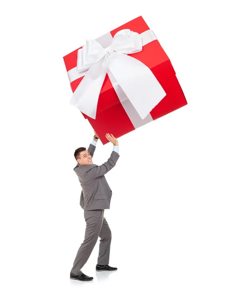 Businessman push big gift box — Stock Photo, Image