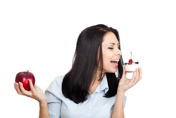 Žena kousnout hračka a drží jablko — Stock fotografie