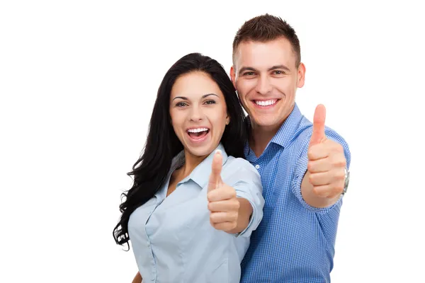 Feliz pareja en el amor emocionado sonriendo y sosteniendo pulgares hacia arriba — Foto de Stock