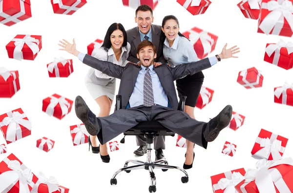 Business people group team push man leader colleague sitting in chair Stock Picture