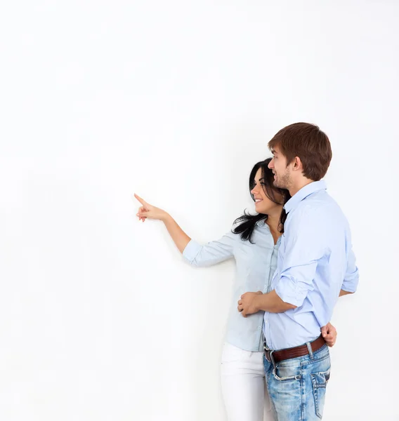 Couple look side point finger to empty copy space Royalty Free Stock Photos