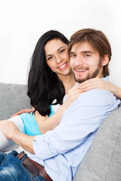 Young couple sitting on the sofa Stock Photo